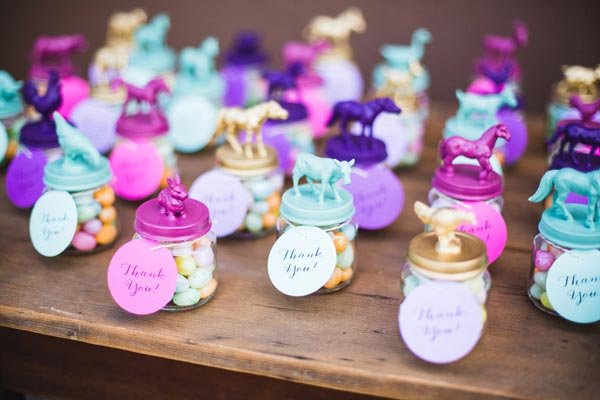 Jars Topped With Bright Blue, Purple And Gold Lids